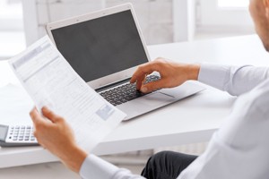 business, office, school and education concept - smiling businessman working in office